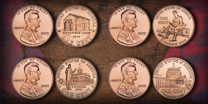 All four 2009 Lincoln Bicentennial cent reverse designs shown together: Early Childhood log cabin, Formative Years Lincoln reading, Professional Life state capitol, Presidency unfinished Capitol dome